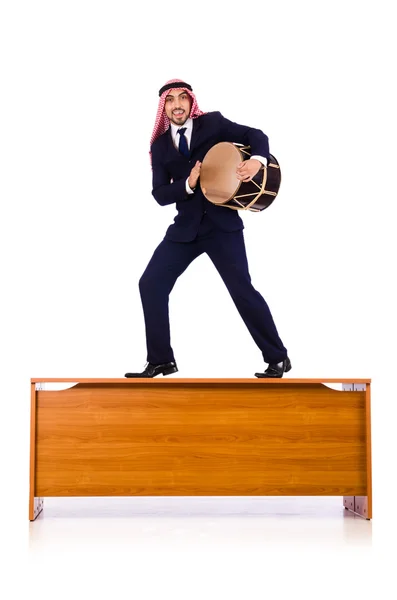 Arab businessman playing drum on desk — Stock Photo, Image