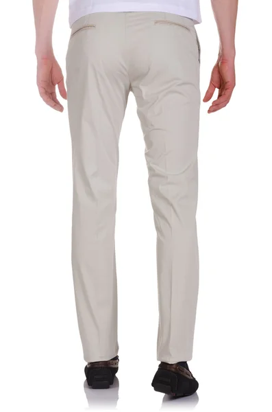 Концепция моды с брюками на белом — стоковое фото