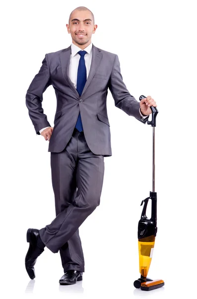 Businessman doing vacuum cleaning on white — Stock Photo, Image