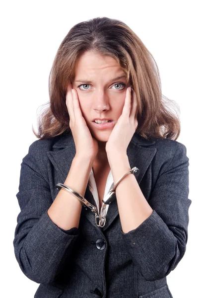 Female businesswoman with handcuffs on white — Stock Photo, Image