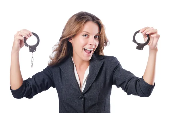 Female businesswoman with handcuffs on white — Stock Photo, Image