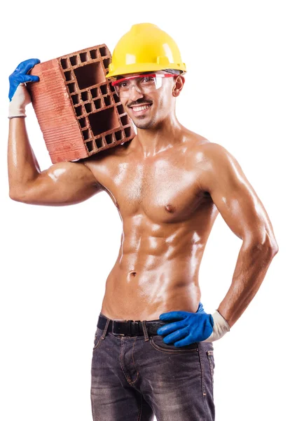 Construtor muscular com tijolos em branco — Fotografia de Stock