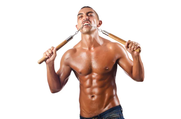 Hombre en el concepto de artes marciales con nunchucks — Foto de Stock