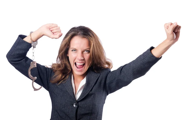 Female businesswoman with handcuffs on white — Stock Photo, Image