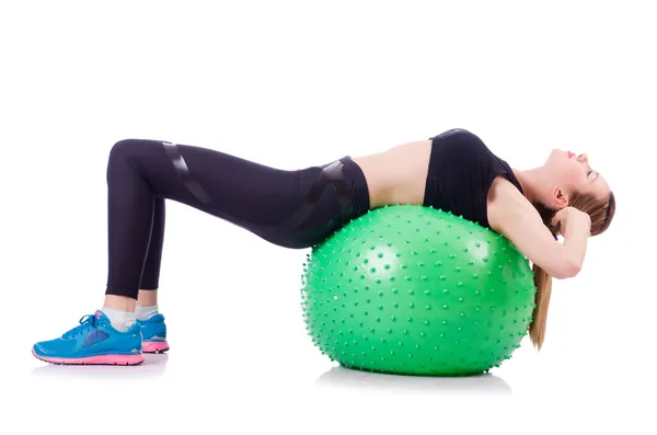 Mulher fazendo exercícios com bola no branco — Fotografia de Stock