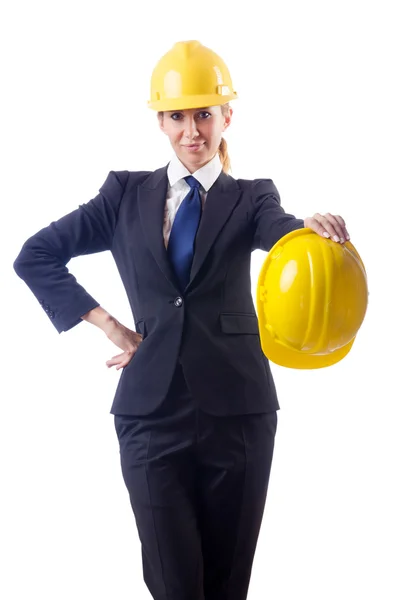 Jeune femme d'affaires avec casque dur sur blanc — Photo