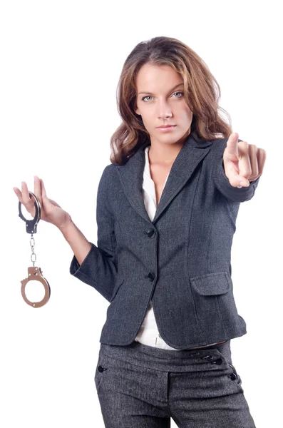 Female businesswoman with handcuffs on white — Stock Photo, Image