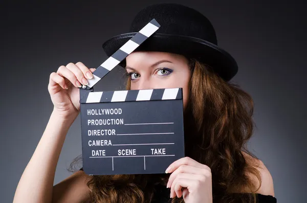 Woman with movie clapper board — Stock Photo, Image