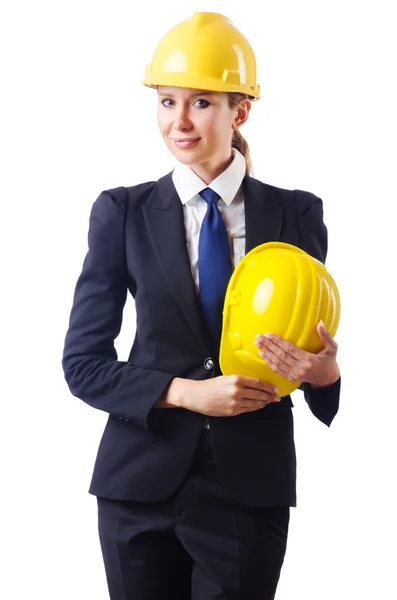 Young businesswoman with hard hat on white — Stock Photo, Image