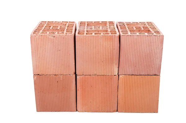 Pilha de tijolos de argila isolados em branco — Fotografia de Stock