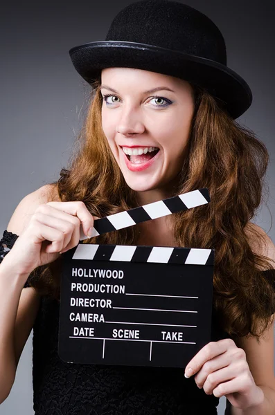 Mujer con película clapper board — Foto de Stock