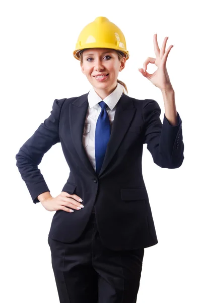 Young businesswoman with hard hat on white — Stock Photo, Image