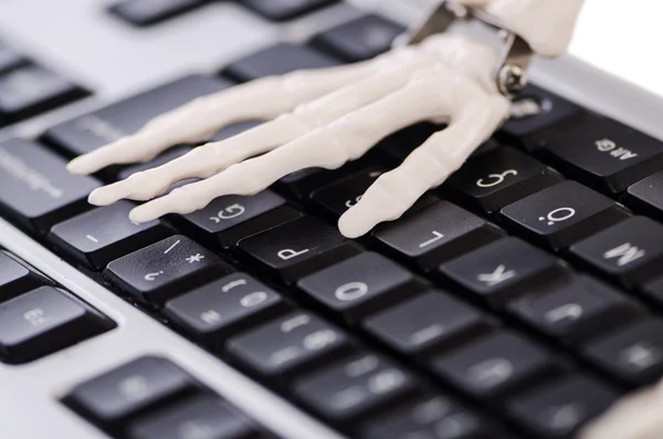 Skeleton working on the keyboard — Stock Photo, Image
