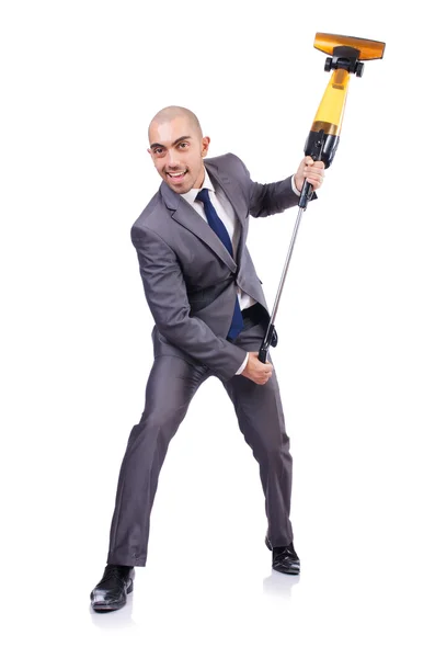 Businessman doing vacuum cleaning on white — Stock Photo, Image