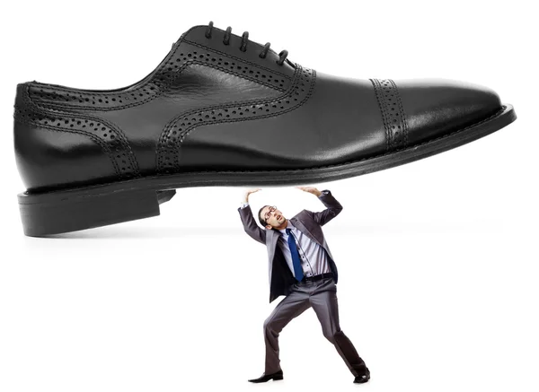 Woman domination concept with shoes and man — Stock Photo, Image