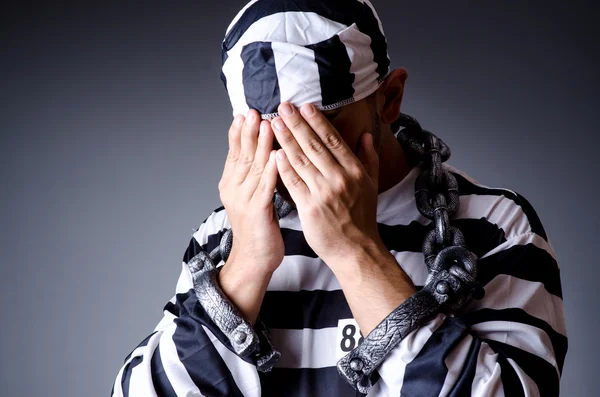 Convict criminal in striped uniform — Stock Photo, Image