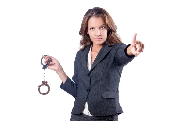 Female businesswoman with handcuffs on white — Stock Photo, Image