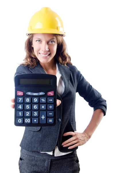 Женщина-строитель с калькулятором на белом — стоковое фото