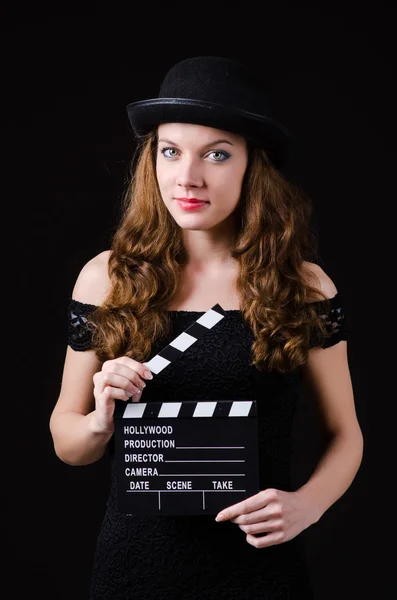 Žena s filmové klapky desky — Stock fotografie