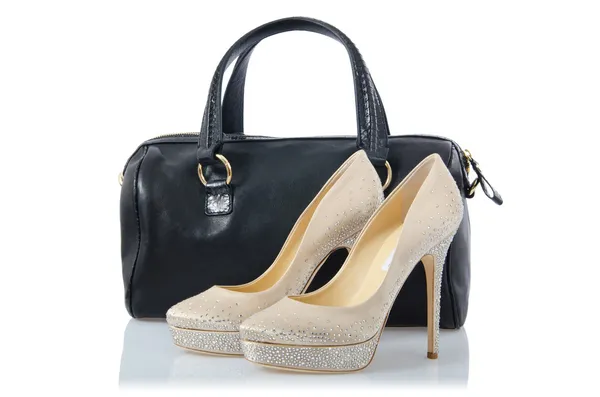 Pair of shoes and bag on white — Stock Photo, Image