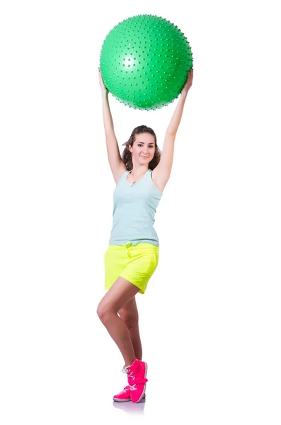 Young woman with ball exercising on white — Stock Photo, Image