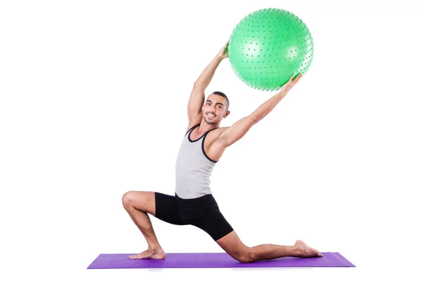 Hombre con pelota suiza haciendo ejercicios en blanco —  Fotos de Stock