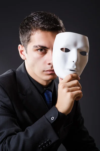 Man with mask in the dark Stock Image