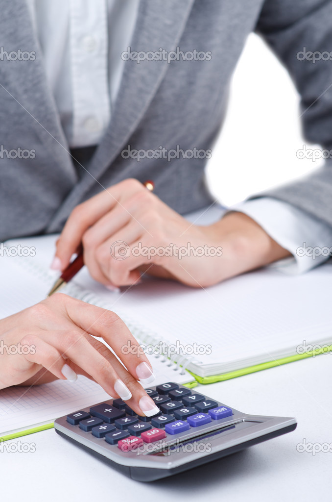 Hands working on the calculator