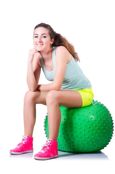 Young woman with ball exercising on white — Stock Photo, Image