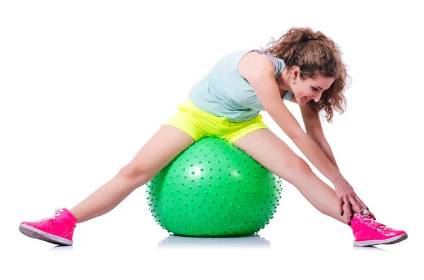Young woman with ball exercising on white — Stock Photo, Image