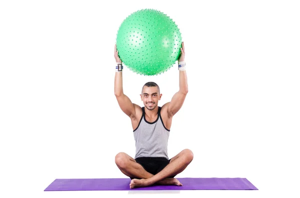 Man with swiss ball doing exercises on white — Stock Photo, Image