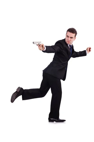 Uomo d'affari con pistola isolata su bianco — Foto Stock
