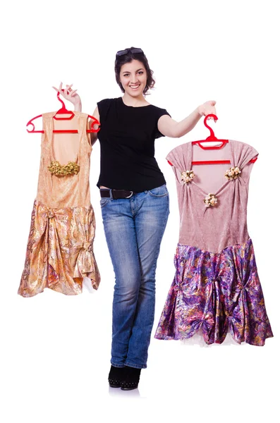 Woman trying to choose dress on white — Stock Photo, Image