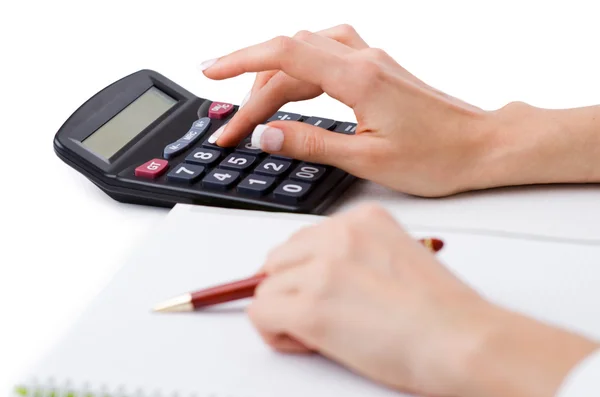 Hands working on the calculator — Stock Photo, Image