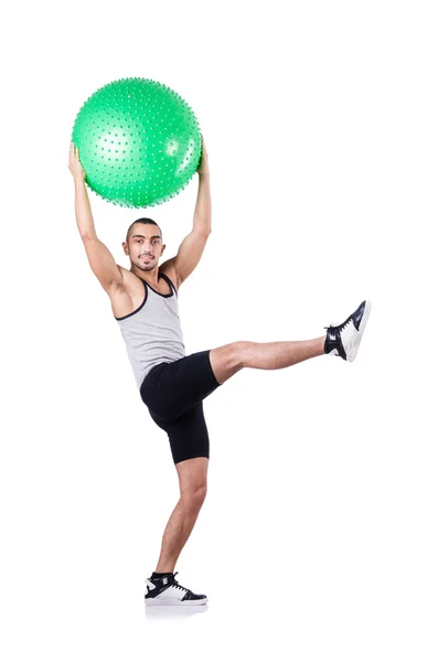 Hombre con pelota suiza haciendo ejercicios en blanco —  Fotos de Stock