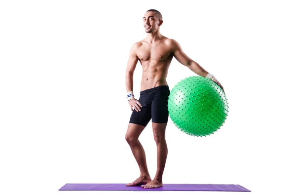 Man with swiss ball doing exercises on white — Stock Photo, Image