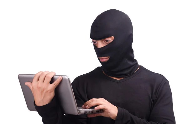 Hacker med dator bär balaclava — Stockfoto