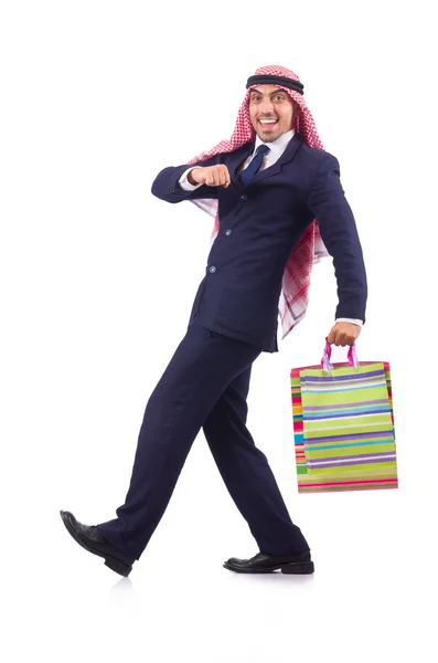 Arab muž s nákupními dárky na bílém — Stock fotografie
