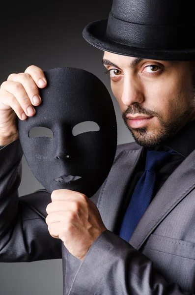 Man with mask in the dark Stock Picture