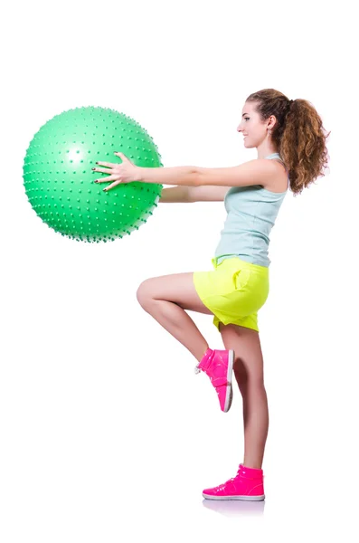 Giovane donna con palla esercizio su bianco — Foto Stock