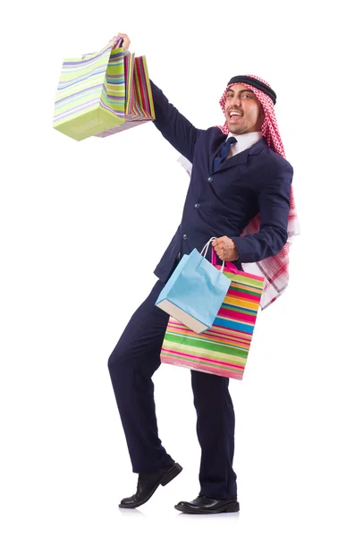 Beyaz üzerinde alışveriş hediyeleri olan bir Arap. — Stok fotoğraf