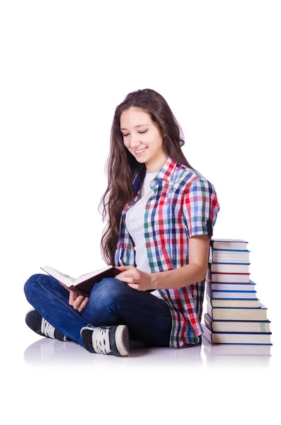 Student mit Büchern auf Weiß — Stockfoto