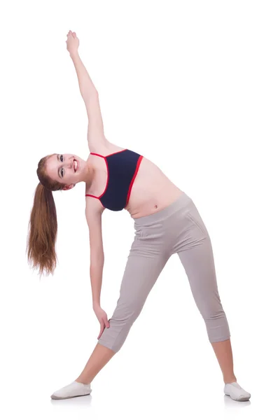 Mladá žena dělá cvičení na bílém — Stock fotografie