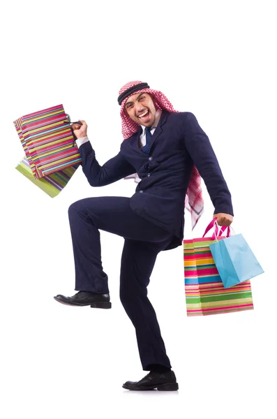 Arabisk man med shopping presenter på vitt — Stockfoto