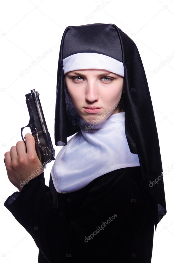 Nun with handgun isolated on white