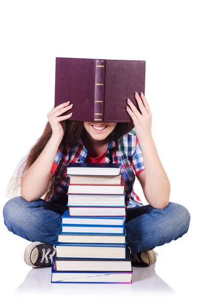 Student mit Büchern auf Weiß — Stockfoto