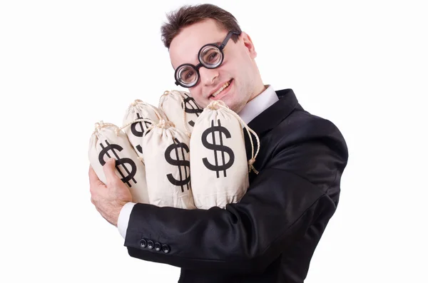 Бізнесмен з мішками грошей на білому — стокове фото