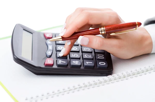 Hands working on the calculator — Stock Photo, Image