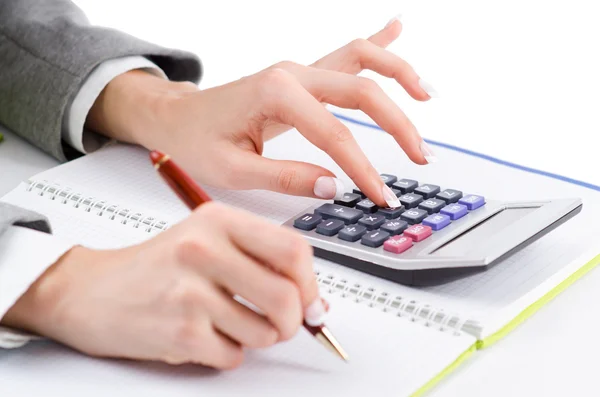 Hands working on the calculator — Stock Photo, Image