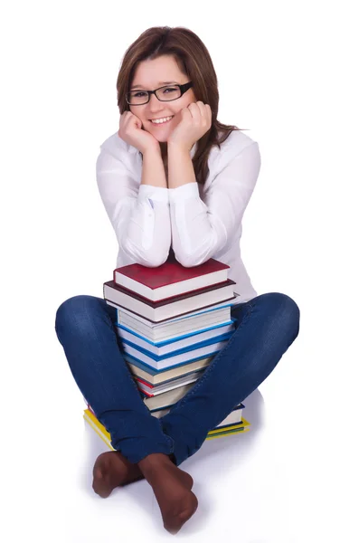 Student mit Büchern auf Weiß — Stockfoto